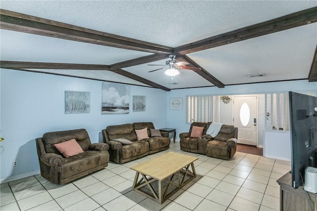 tiled living room with vaulted ceiling with beams, ceiling fan, and a textured ceiling