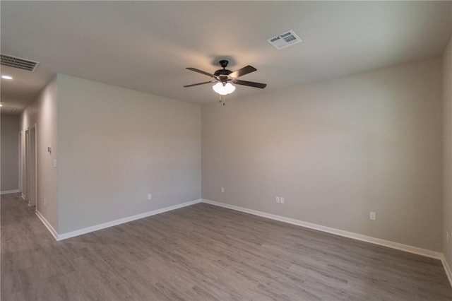 spare room featuring ceiling fan and wood-type flooring