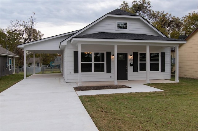 bungalow-style house featuring a front lawn and covered porch