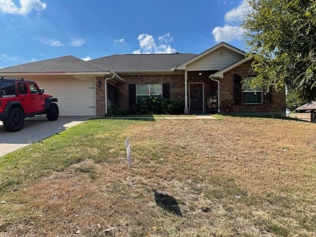 single story home featuring a front yard and a garage