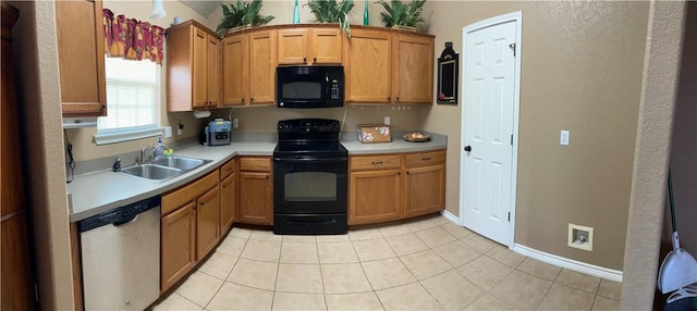 kitchen with sink, light tile patterned flooring, and black appliances