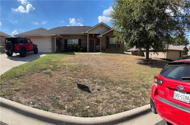 single story home with a front yard and a garage