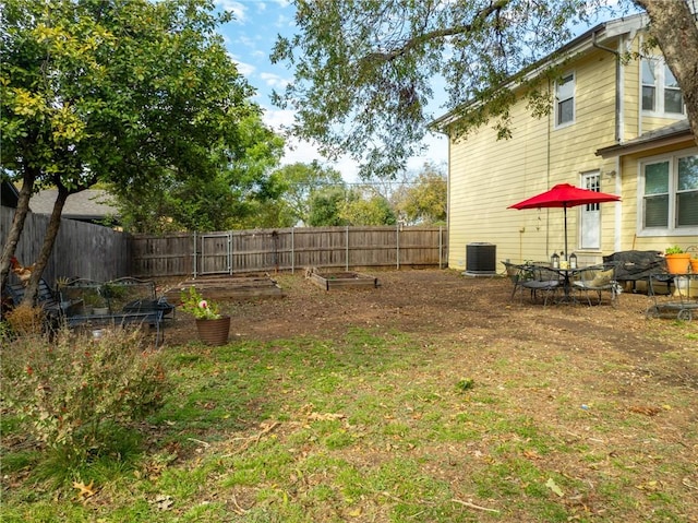 view of yard with central AC