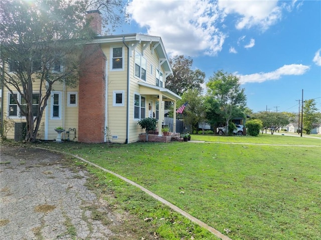 view of property exterior with a lawn