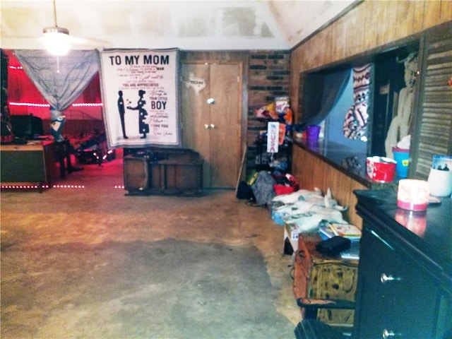 garage featuring wooden walls