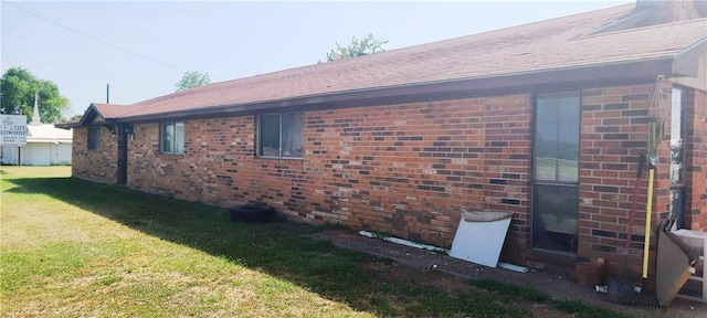 view of property exterior with a yard