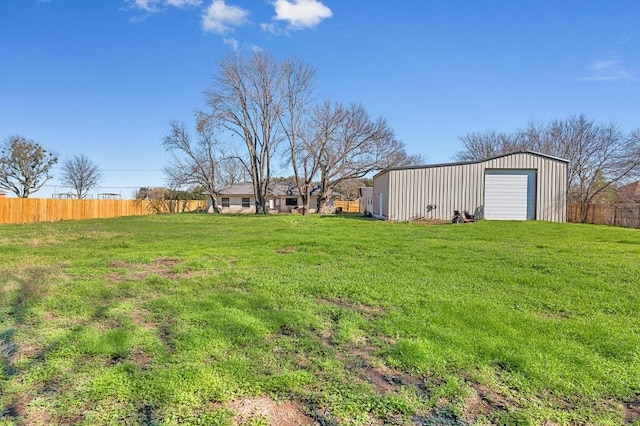 view of yard with an outbuilding and a garage