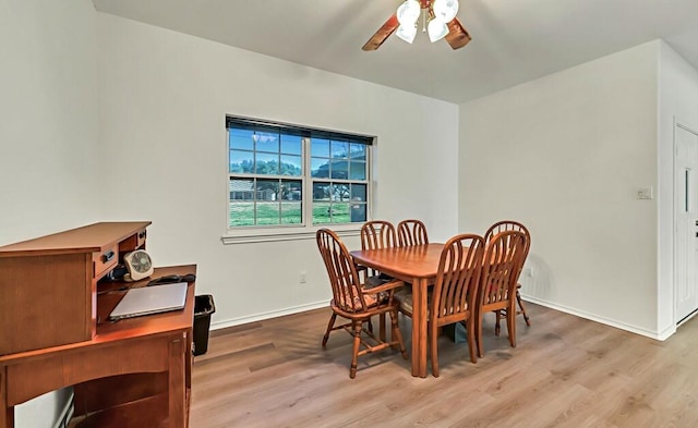 dining area featuring ceiling fan and light wood-type flooring