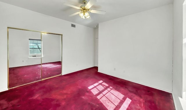 unfurnished bedroom featuring carpet, a closet, and ceiling fan