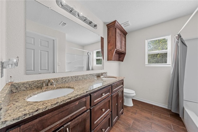 full bathroom featuring toilet, vanity, shower / tub combo, and hardwood / wood-style flooring