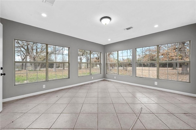 unfurnished sunroom with a wealth of natural light