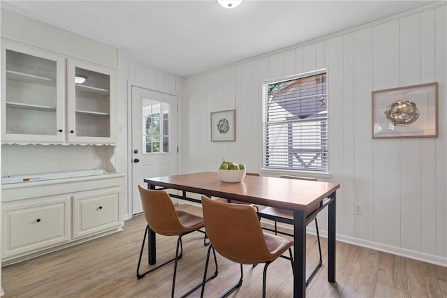 dining room with a wealth of natural light and light hardwood / wood-style floors