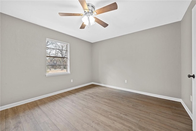 unfurnished room with ceiling fan and wood-type flooring