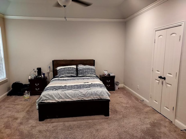 bedroom with carpet flooring, ceiling fan, and crown molding