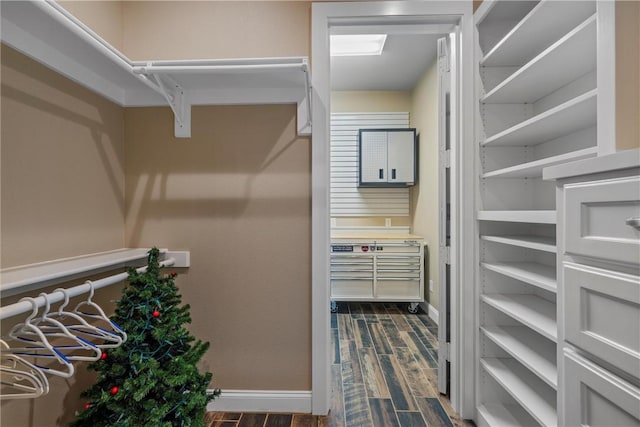 spacious closet with wood tiled floor