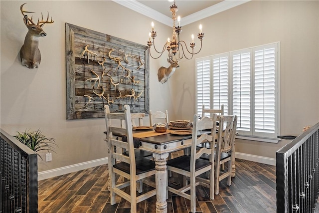 dining room featuring a notable chandelier, crown molding, baseboards, and wood finished floors