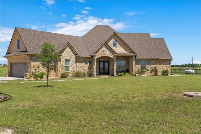 view of front of house featuring a front lawn, french doors, and stone siding