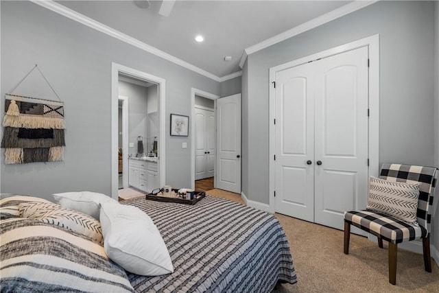 bedroom featuring crown molding, baseboards, a closet, and light carpet