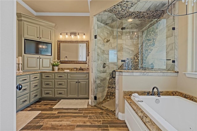 full bathroom with vanity, wood tiled floor, a shower stall, crown molding, and a bath