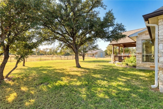 view of yard featuring a wooden deck