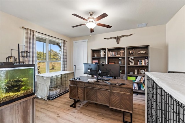 office area with ceiling fan and light hardwood / wood-style flooring