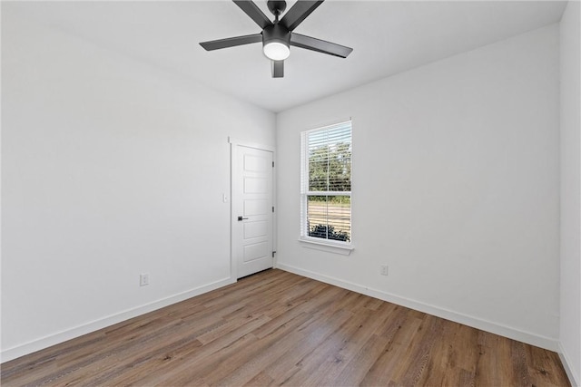 spare room featuring ceiling fan and light hardwood / wood-style floors