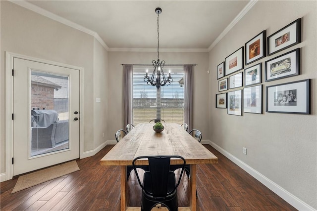 dining room with a notable chandelier, dark wood-type flooring, baseboards, and ornamental molding