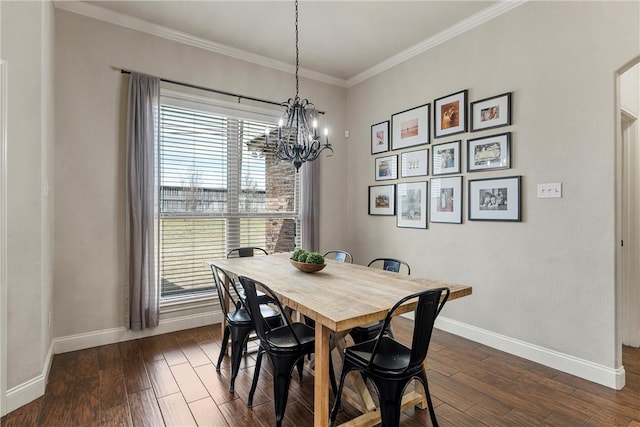 dining space featuring crown molding, baseboards, dark wood-type flooring, and an inviting chandelier