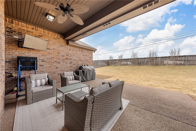 view of patio / terrace featuring ceiling fan, an outdoor living space, a grill, and a fenced backyard