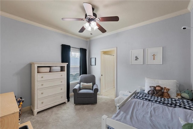 bedroom featuring connected bathroom, crown molding, baseboards, ceiling fan, and light colored carpet