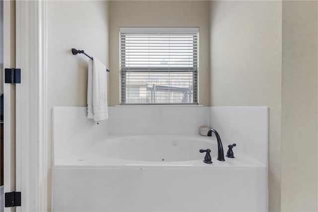 bathroom featuring a whirlpool tub