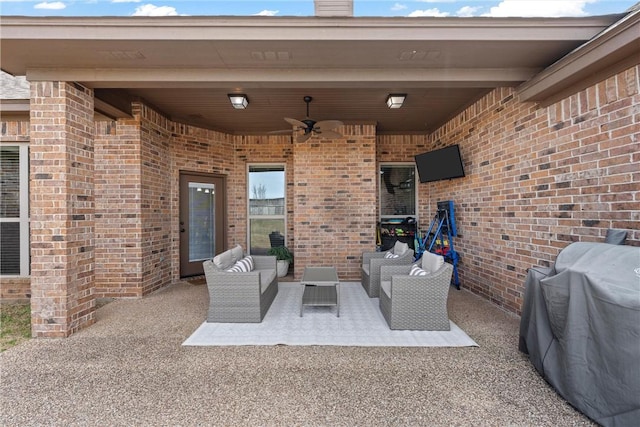 view of patio with an outdoor living space, area for grilling, and ceiling fan