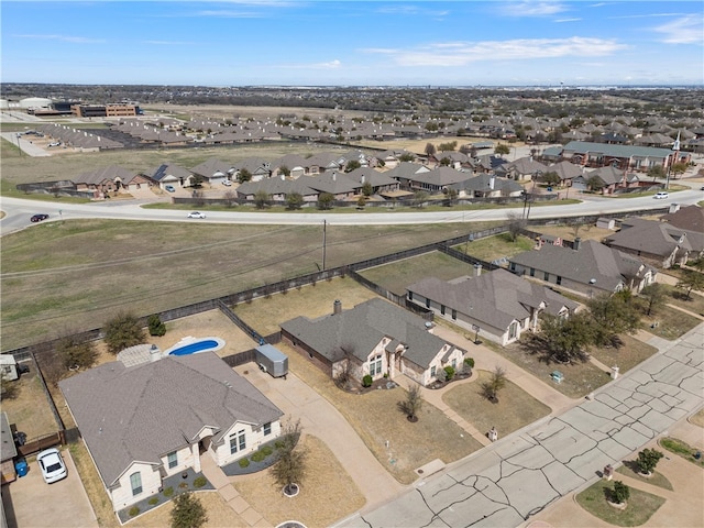 birds eye view of property with a residential view