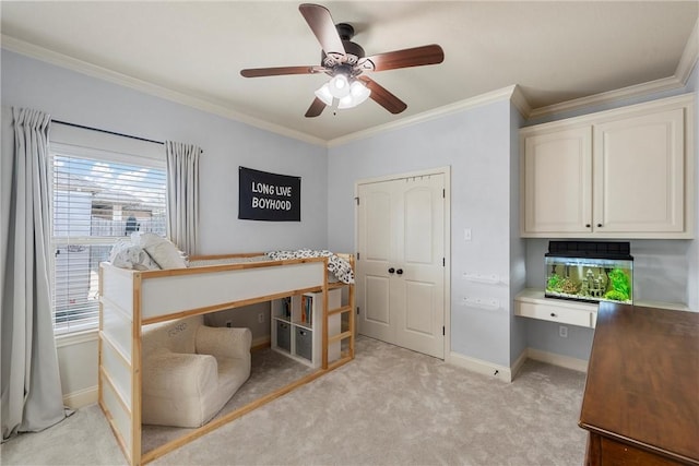 office with light carpet, a ceiling fan, crown molding, and baseboards