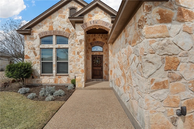 view of exterior entry with stone siding