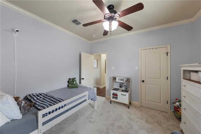 bedroom featuring visible vents, light colored carpet, ceiling fan, and ornamental molding