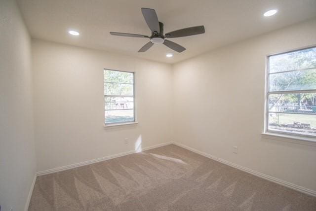 carpeted empty room with ceiling fan