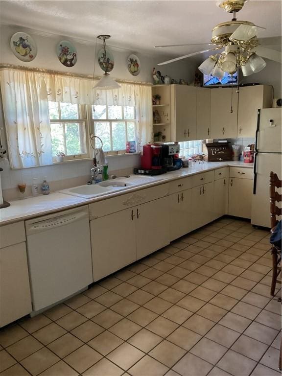 kitchen featuring white cabinets, white appliances, ceiling fan, and sink