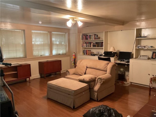 living room with beam ceiling, hardwood / wood-style flooring, and washer / clothes dryer