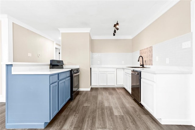 kitchen with kitchen peninsula, decorative backsplash, sink, black appliances, and wood-type flooring