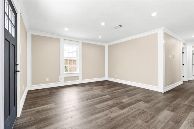 entryway featuring dark hardwood / wood-style flooring and ornamental molding