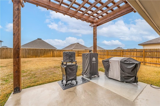 view of patio featuring area for grilling and a pergola