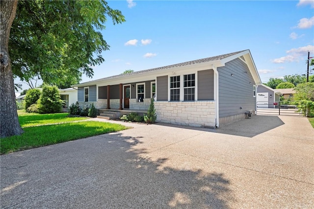 ranch-style house with a front lawn and a porch