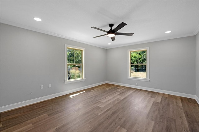 empty room with ceiling fan, wood-type flooring, ornamental molding, and a wealth of natural light