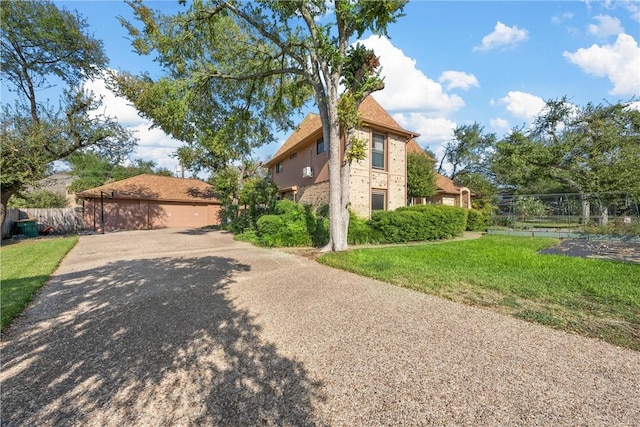 view of side of home featuring a yard