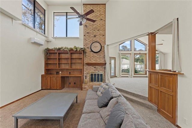 carpeted living room featuring a wealth of natural light, a high ceiling, and a brick fireplace