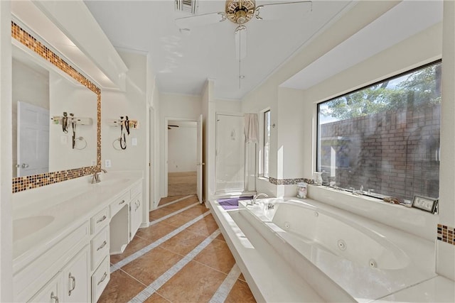 bathroom featuring a bathtub, vanity, tile patterned floors, crown molding, and ceiling fan