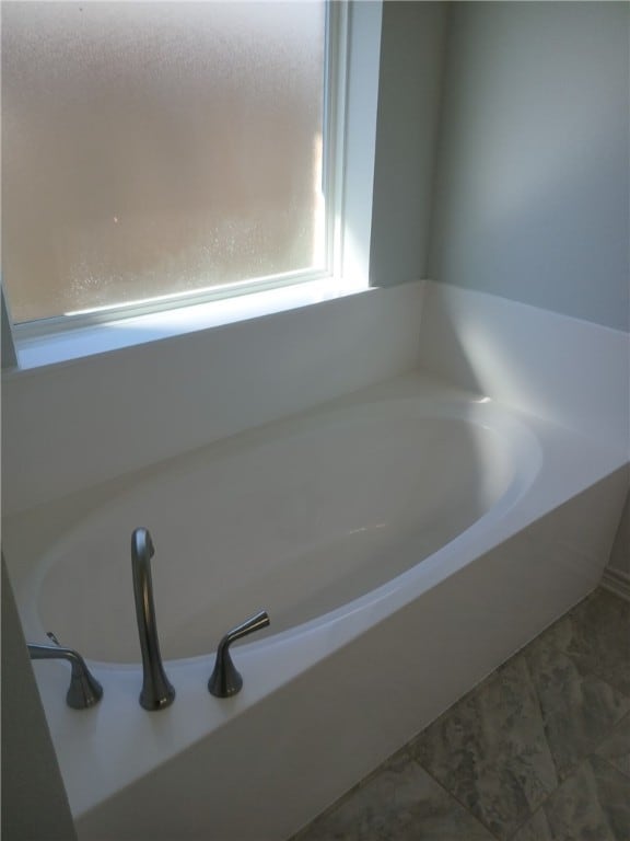 bathroom featuring a bathtub