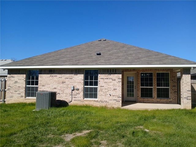 back of house with a yard, a patio area, and central air condition unit