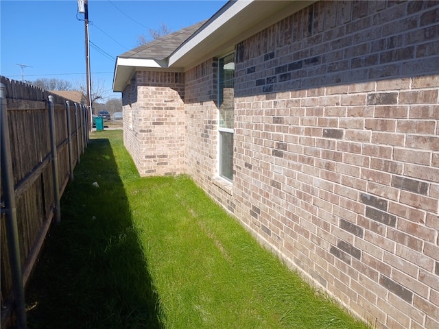 view of home's exterior with a lawn